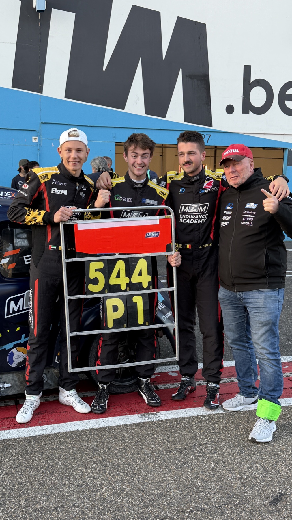#544 crew with the P1 pit board — Zolder